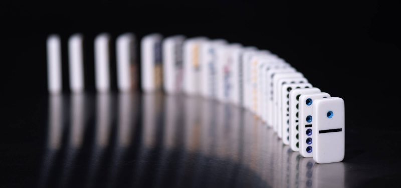 White dominoes on black background